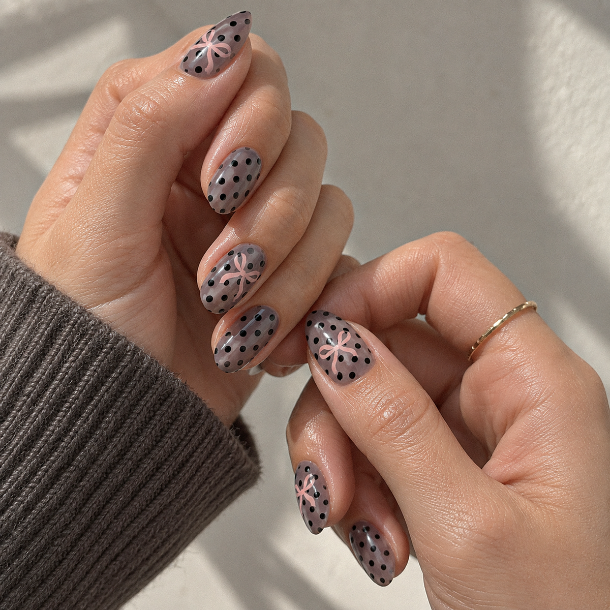 Black Betty Polka Dots by Make Them Gelly, worn on a hand