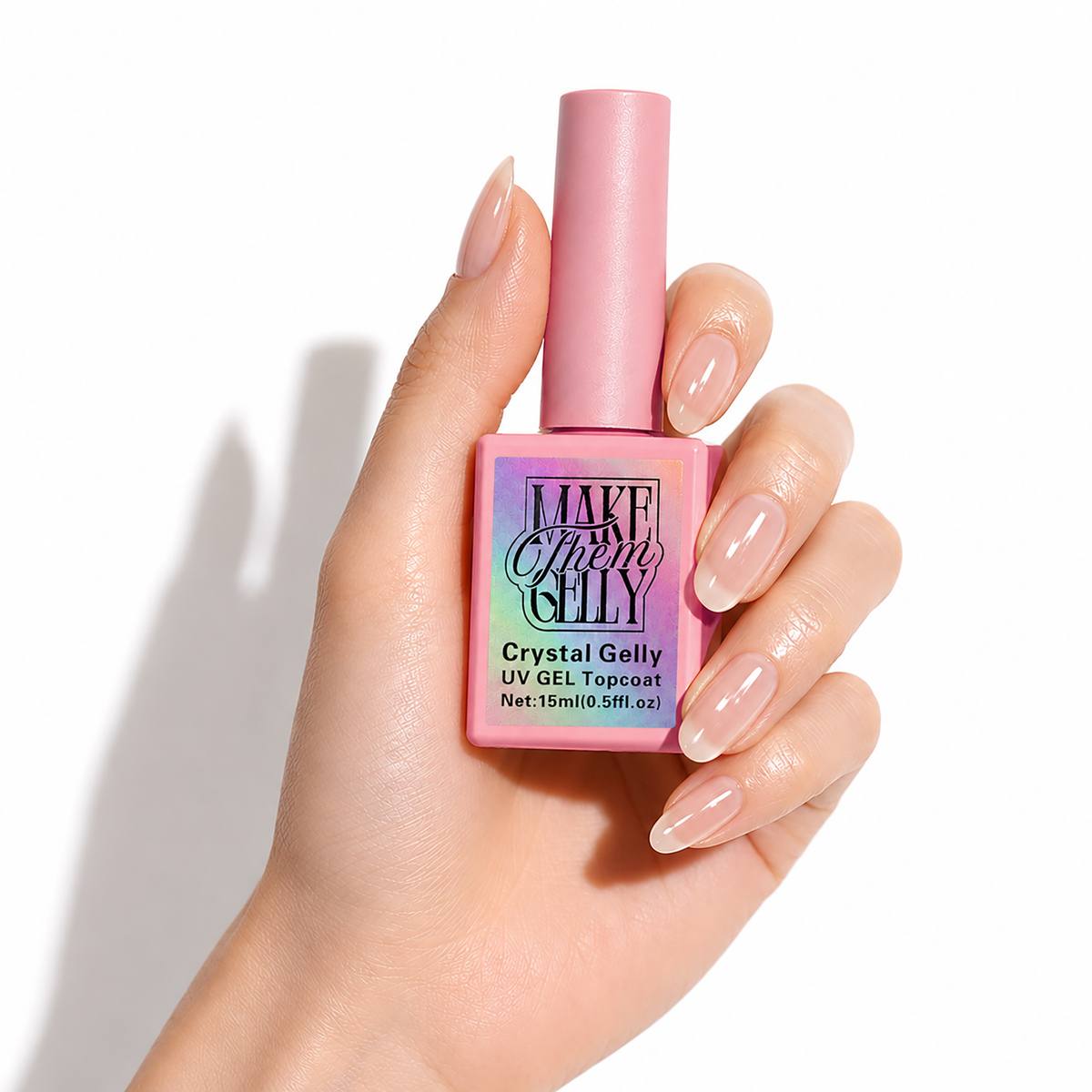 Crystal Gelly UV Gel Topcoat by Make Them Gelly, worn on a hand