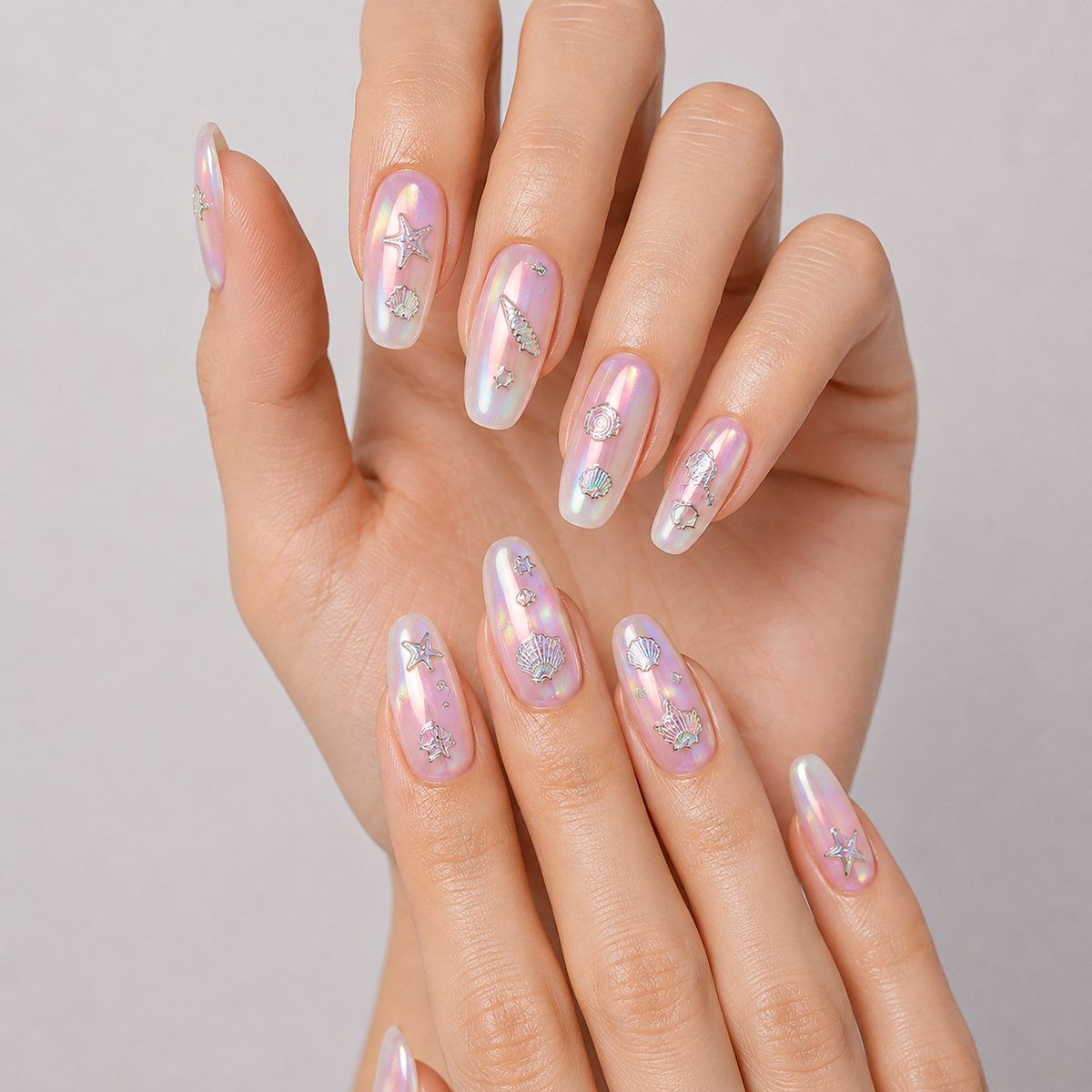 Holographic Pearl Shells by Make Them Gelly, worn on a hand
