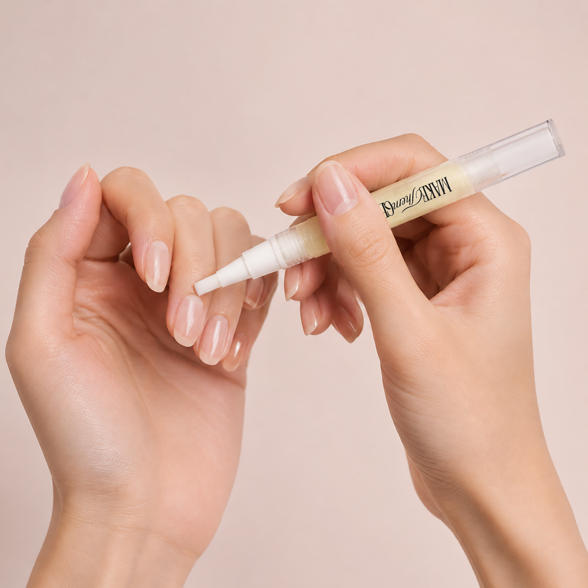 Marshmallow Glow-Up Nail Elixir by Make Them Gelly, worn on a hand