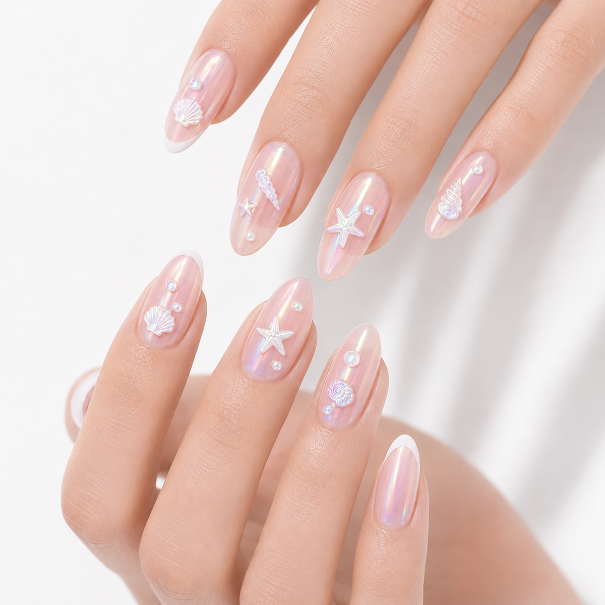 Rainbow Pearl Shells by Make Them Gelly, worn on a hand