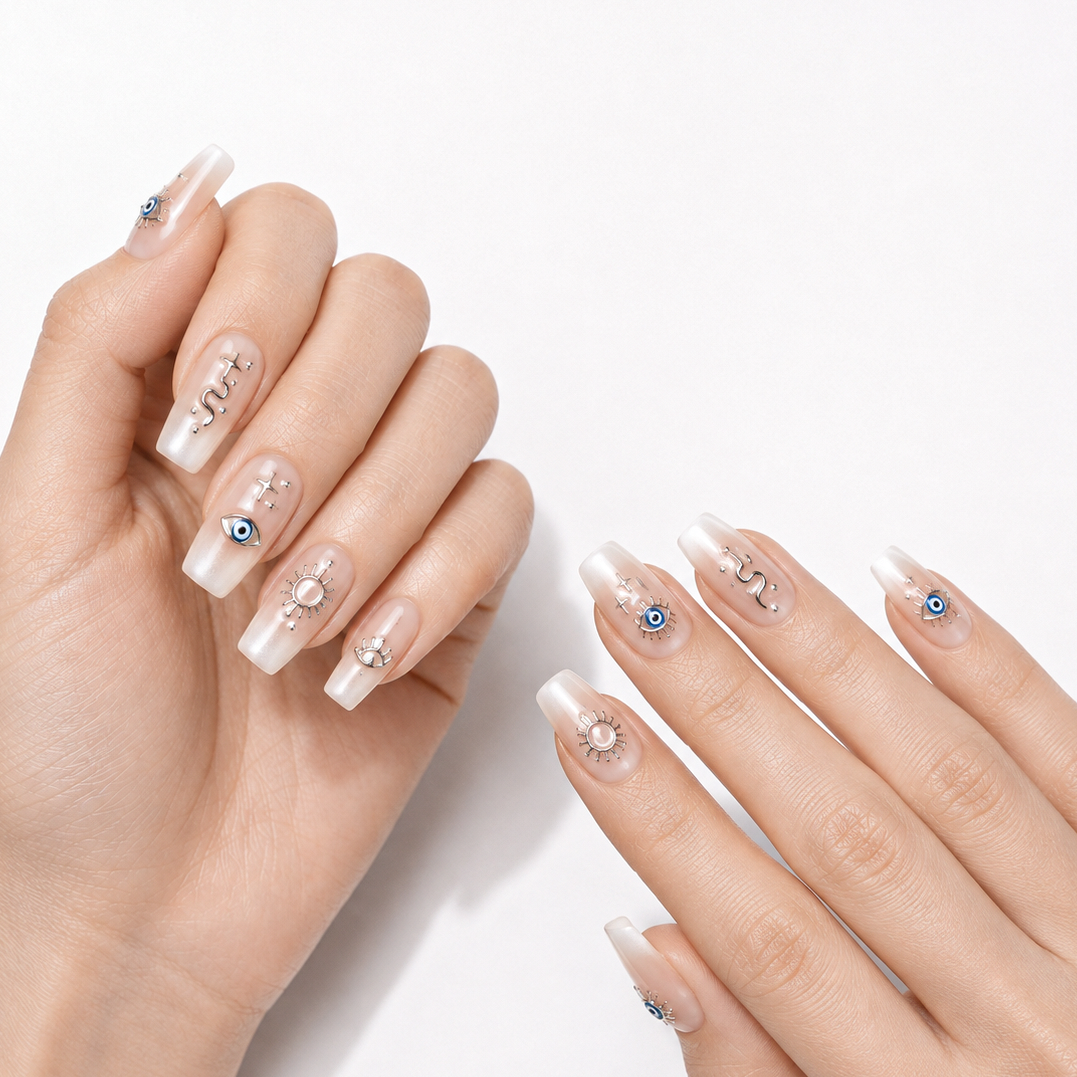 Silver Protective Evil Eyes by Make Them Gelly, worn on a hand