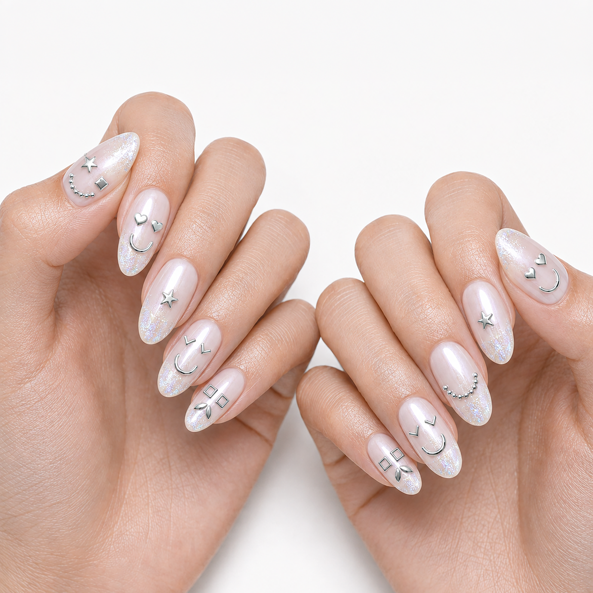 Silver Faces by Make Them Gelly, worn on a hand